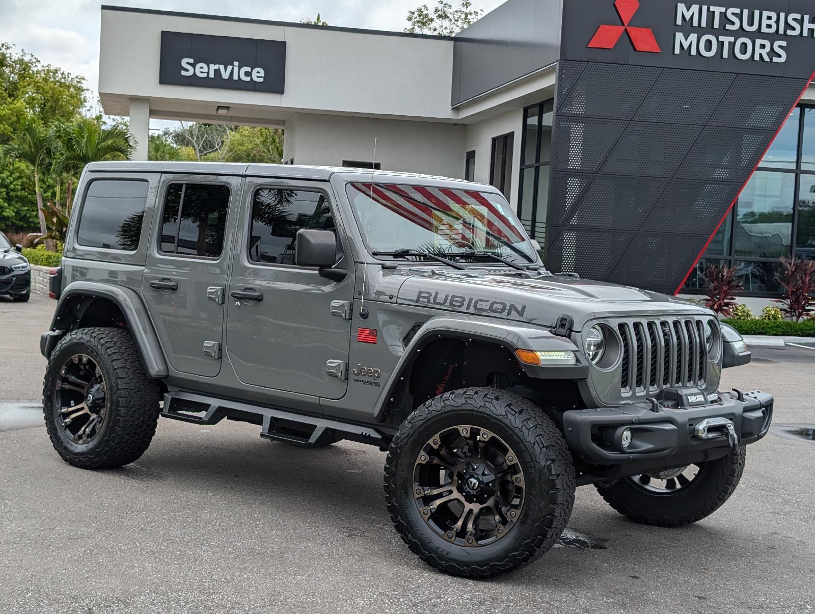 Used 2021 Jeep Wrangler Unlimited Rubicon with VIN 1C4JJXFM2MW687859 for sale in New Port Richey, FL