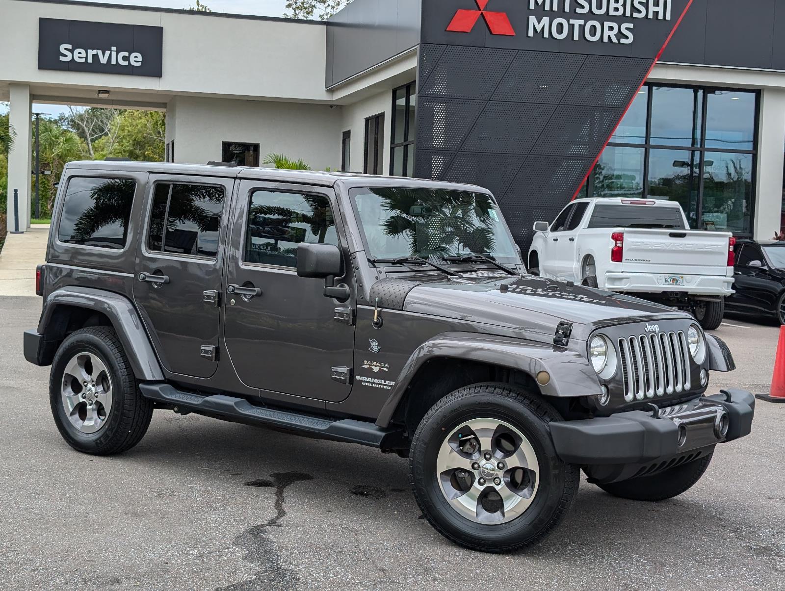 Used 2016 Jeep Wrangler Unlimited Sahara with VIN 1C4BJWEG6GL293331 for sale in New Port Richey, FL