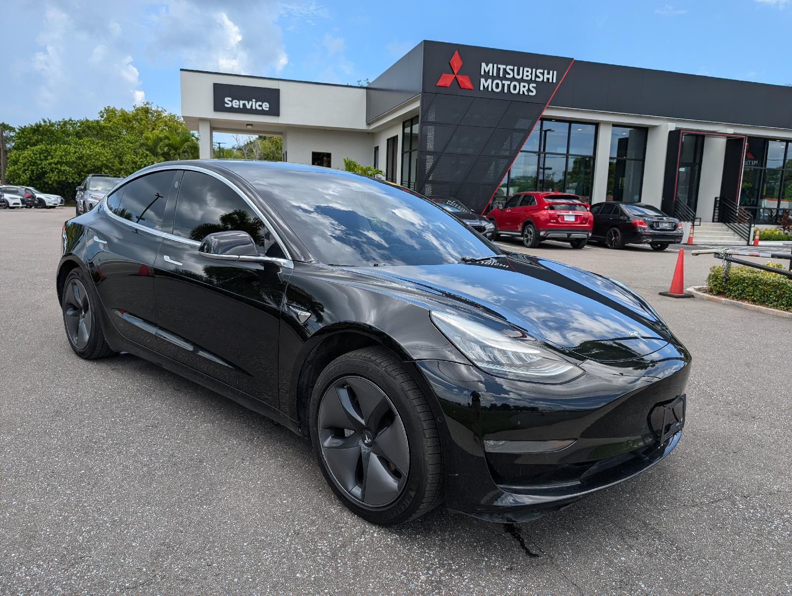 Used 2019 Tesla Model 3 Mid Range with VIN 5YJ3E1EA9KF337597 for sale in New Port Richey, FL