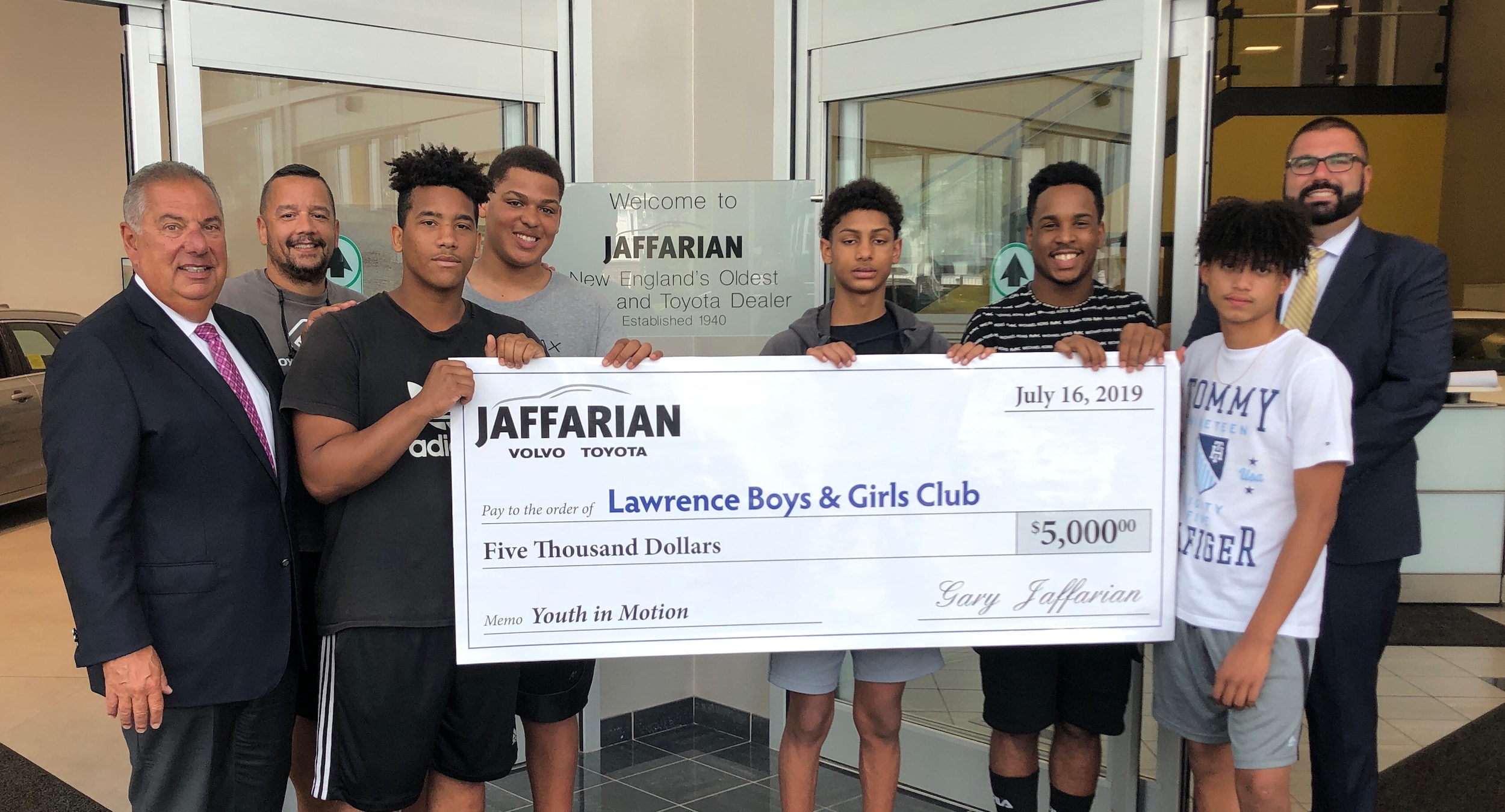 Gary Jaffarian donating a check to Lawrence Boys & Girls Club