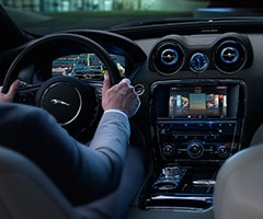 Behind the steering wheel of a certified pre-owned Jaguar car.
