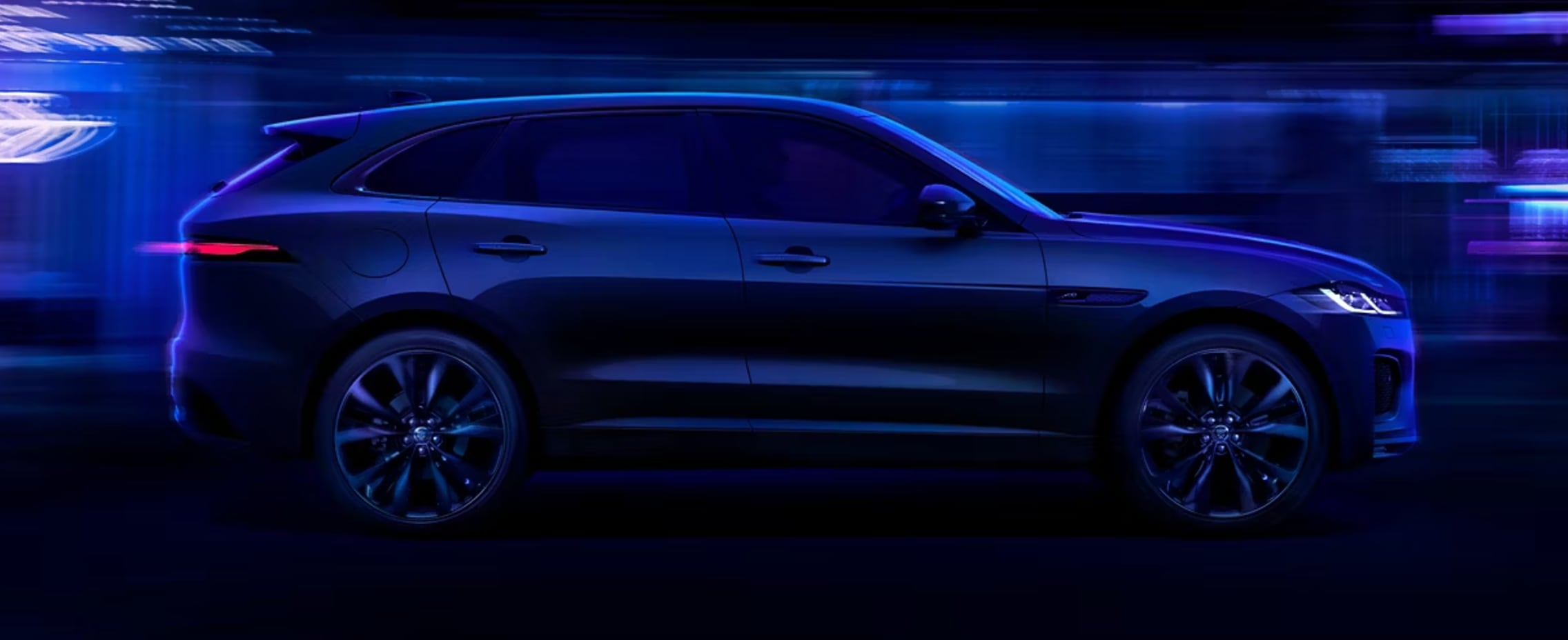 2025 Jaguar F-Pace driving through city streets 