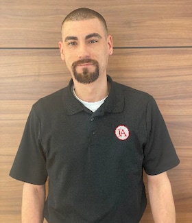 Staff member Chris Zuniga from 4383dff02f50
