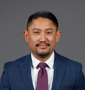 Staff member Mike Tran from ID_009674