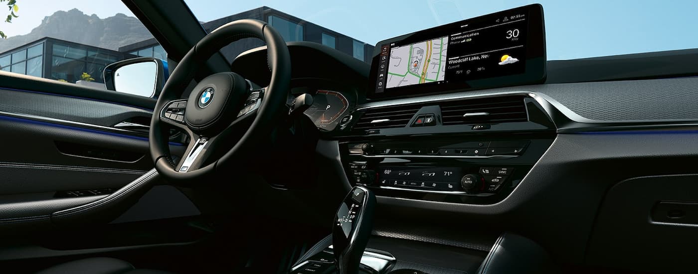 A close up shows the dash and infotainment screen on 2021 BMW 5 Series.