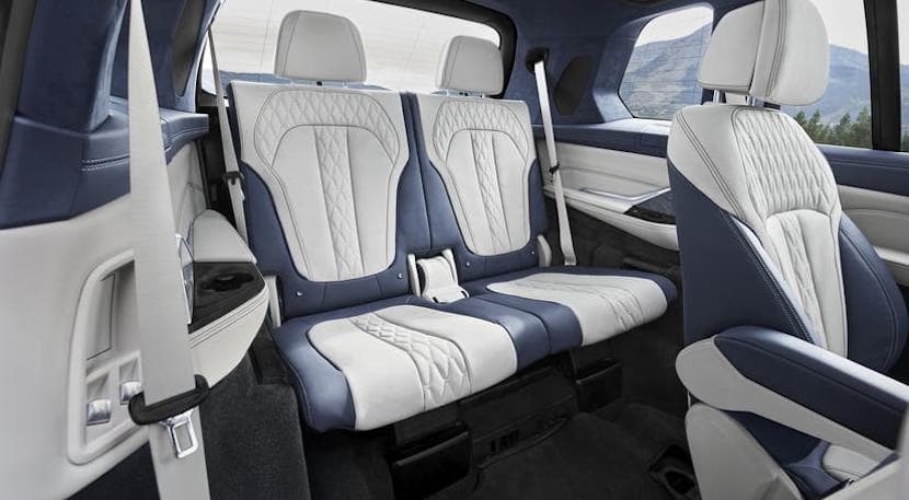 The blue and white rear seats are shown within a 2020 BMW X7, winner of the 2020 BMW X7 vs 2020 BMW X5 comparison.