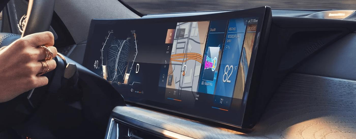 A close up of the infotainment screen on a 2023 BMW X7 is shown.