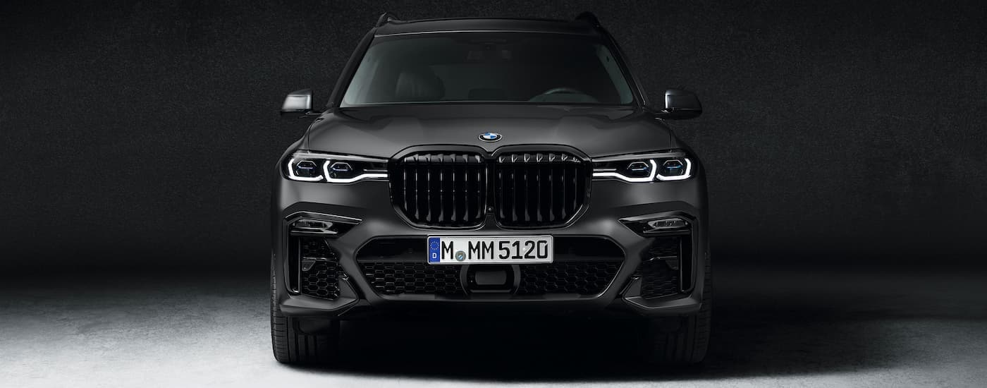 A black 2021 BMW X7 Dark Shadow Edition is shown against a dark background.