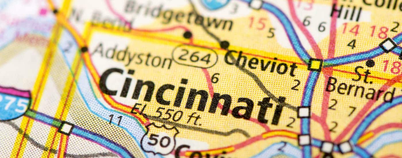 A close up shows a road map of Cincinnati.