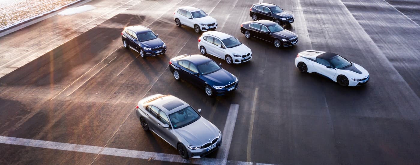 A group of 2019 BMW EVs are shown from a high angle parked on an airstrip.