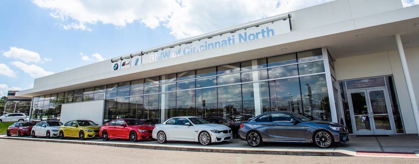 Several cars are shown in front of the BMW of Cincinnati North building.