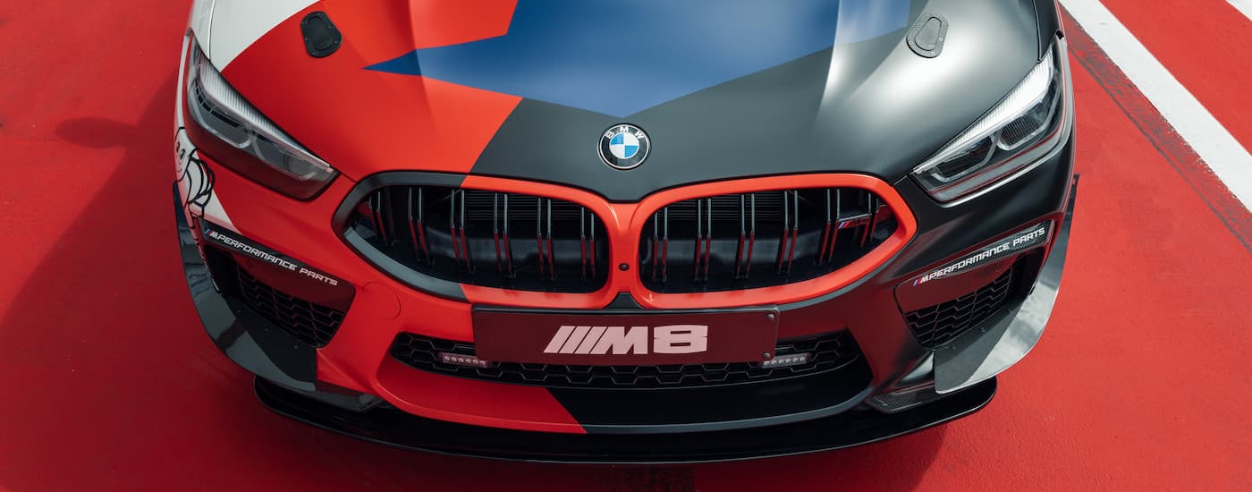 A close up shows the front grille and hood on a 2020 BMW M8 Gran Coupe safety car.