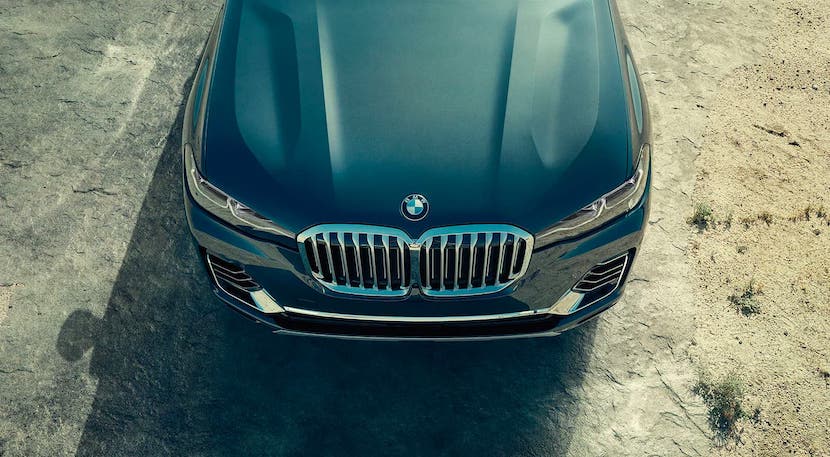 The hood of a gray 2020 BMW X7 is shown from above while parked in a dirt lot near Cincinnati, OH.