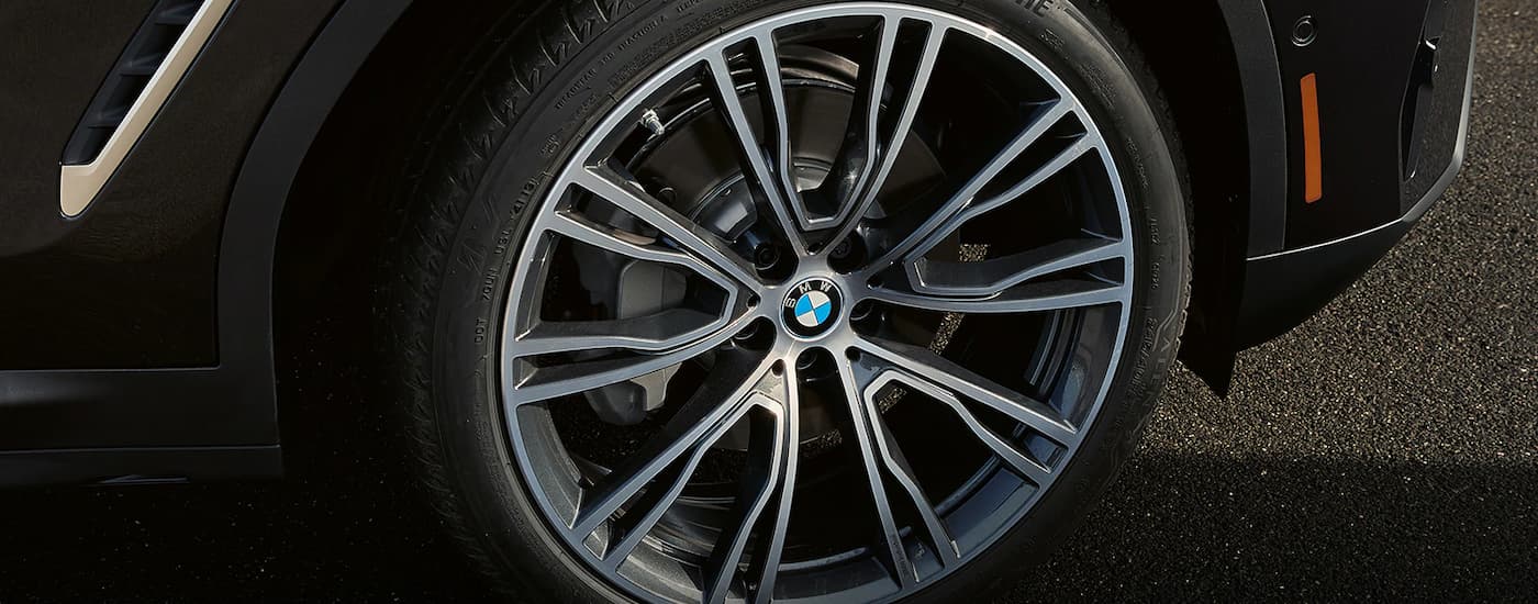 A close up of the rim on a 2023 BMW X3 is shown.