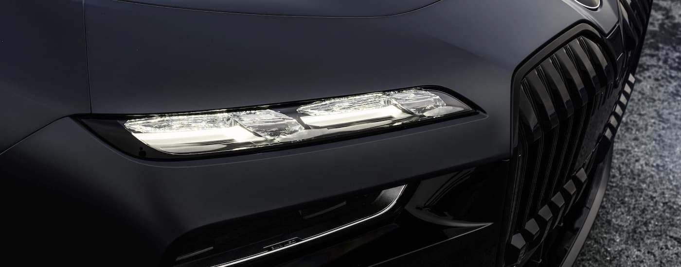 A close up shows the passenger side headlight on a 2022 BMW 760i.