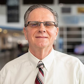 Staff member John Williams from ID_d3bebee1f6dc