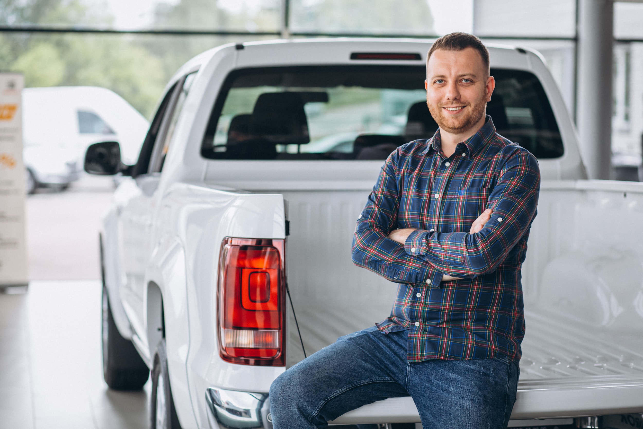 young-man-buying-car-car-showroom.jpg