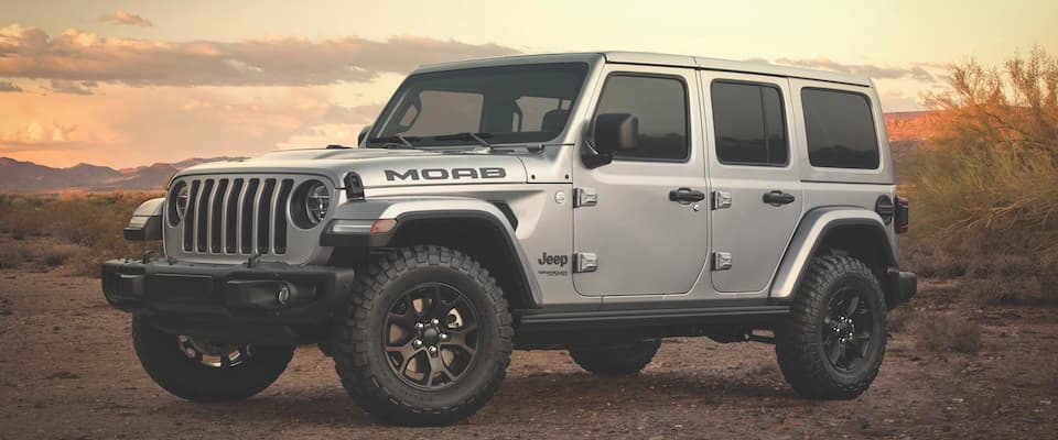 A sivler 2019 Jeep Wrangler MOAB parked in the desert