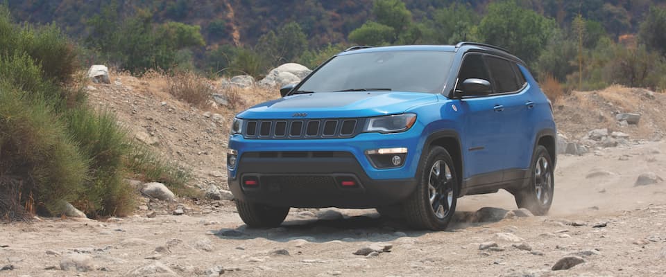Jeep Cherokee A blue Jeep Cherokee offroading