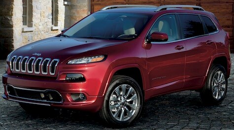 2019 Jeep Cherokee A red 2019 Jeep Cherokee parked in a driveway