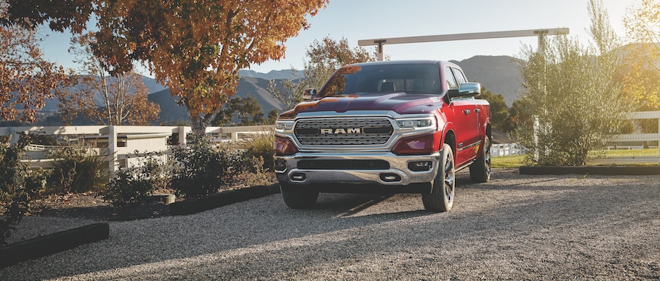 2019 Ram 1500 A red 2019 Ram 1500 driving on to a farm