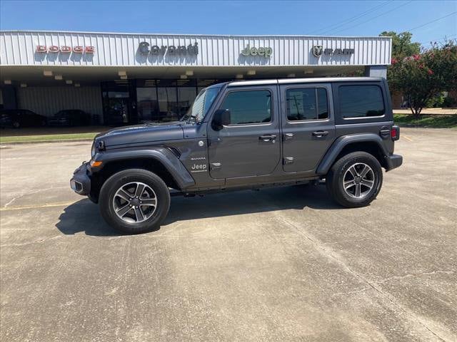 Used 2023 Jeep Wrangler 4-Door Sahara with VIN 1C4HJXENXPW702055 for sale in Greenville, MS