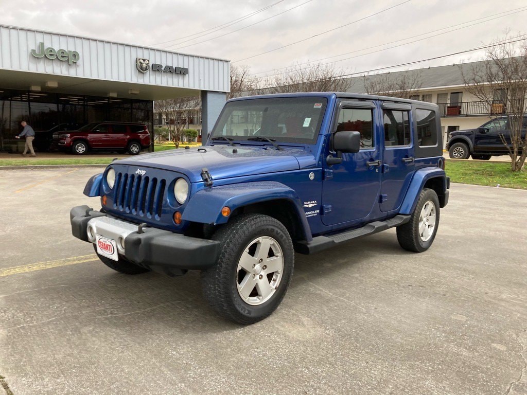 Used 2009 Jeep Wrangler Unlimited Sahara with VIN 1J4GA59159L713907 for sale in Greenville, MS