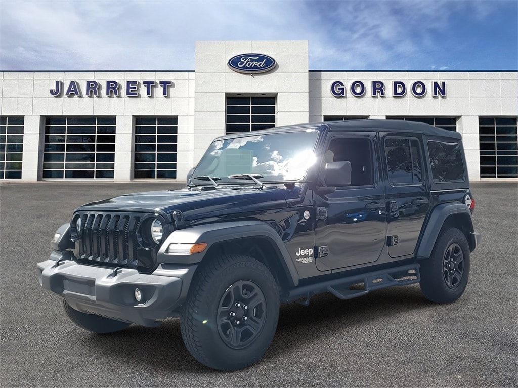 Used 2021 Jeep Wrangler Unlimited Sport with VIN 1C4HJXDG6MW623058 for sale in Davenport, FL