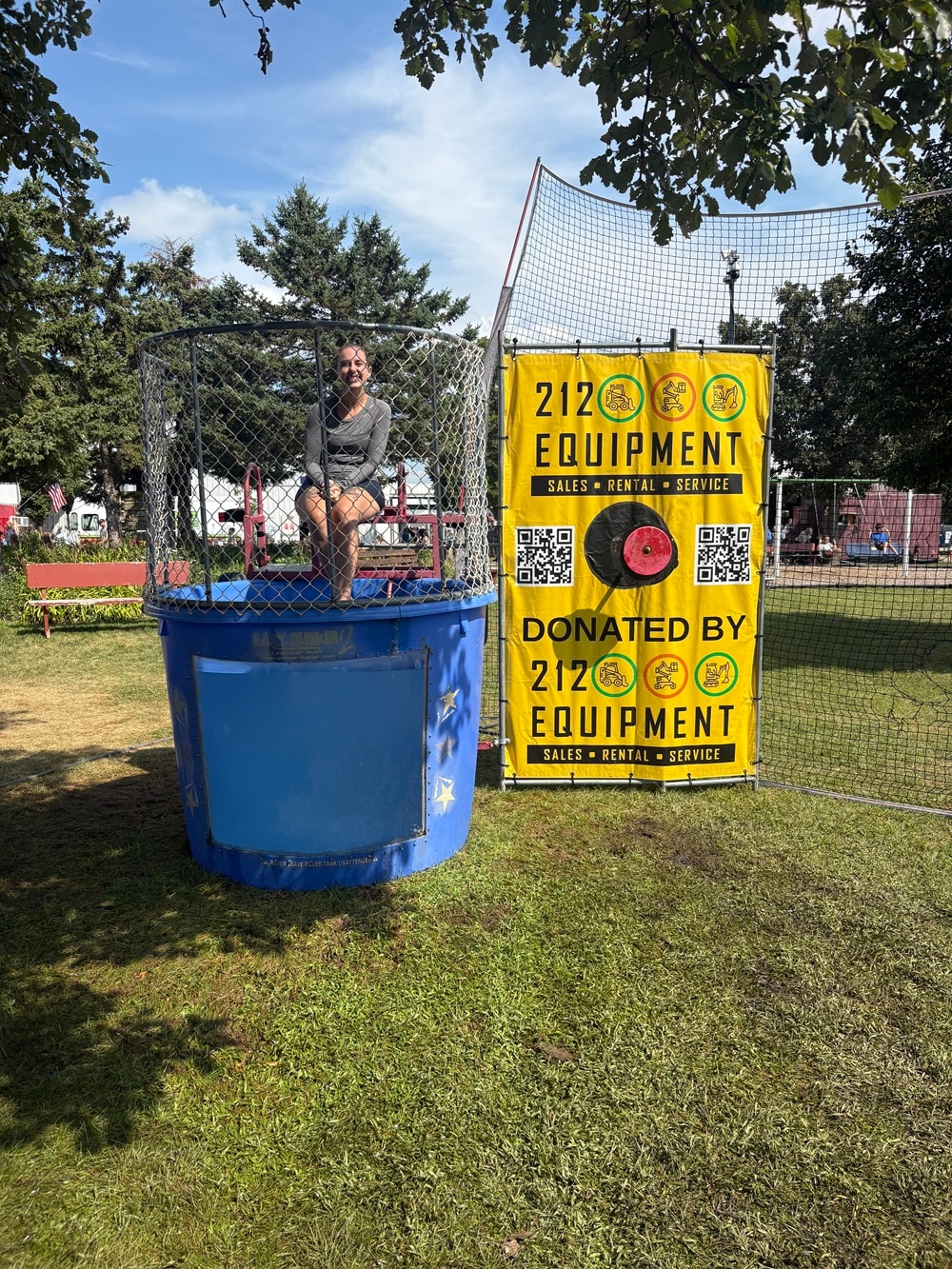 Jordan Malone-Forst volunteers in the dunk tank at the McLeod County Fair to raise funds for Hutchinson Youth Baseball