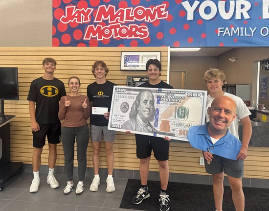 Hutchinson High School football captains Hayden Benson, Grady Campbell, Jack Hantge, and Luke Ostlie at Jay Malone Ford