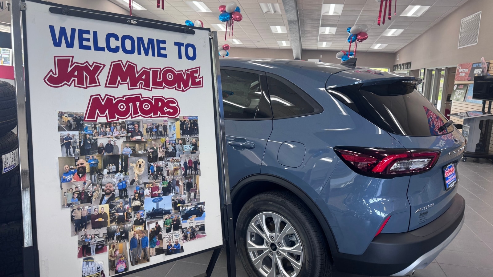 Welcome to Jay Malone Motors homemade sign featuring the team in Hutchinson, MN