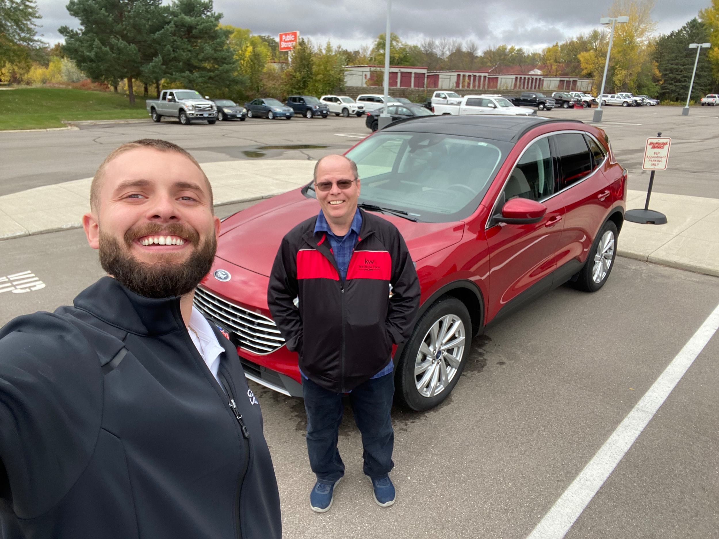 Happy Jay Malone Ford customer with their used Ford Escape in Hutchinson MN