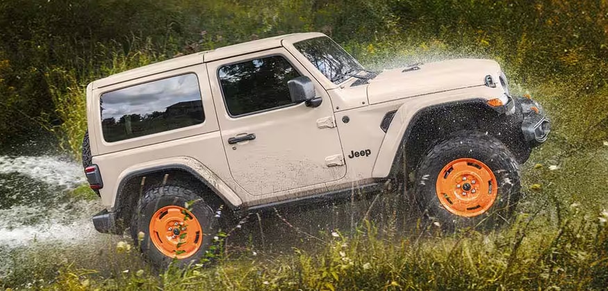 2027 Jeep Wrangler JL-2A tackling off-road terrain