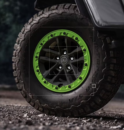 2027 Jeep Wrangler Switchback 17-inch beadlock wheel with Gecko painted ring and all-terrain tire