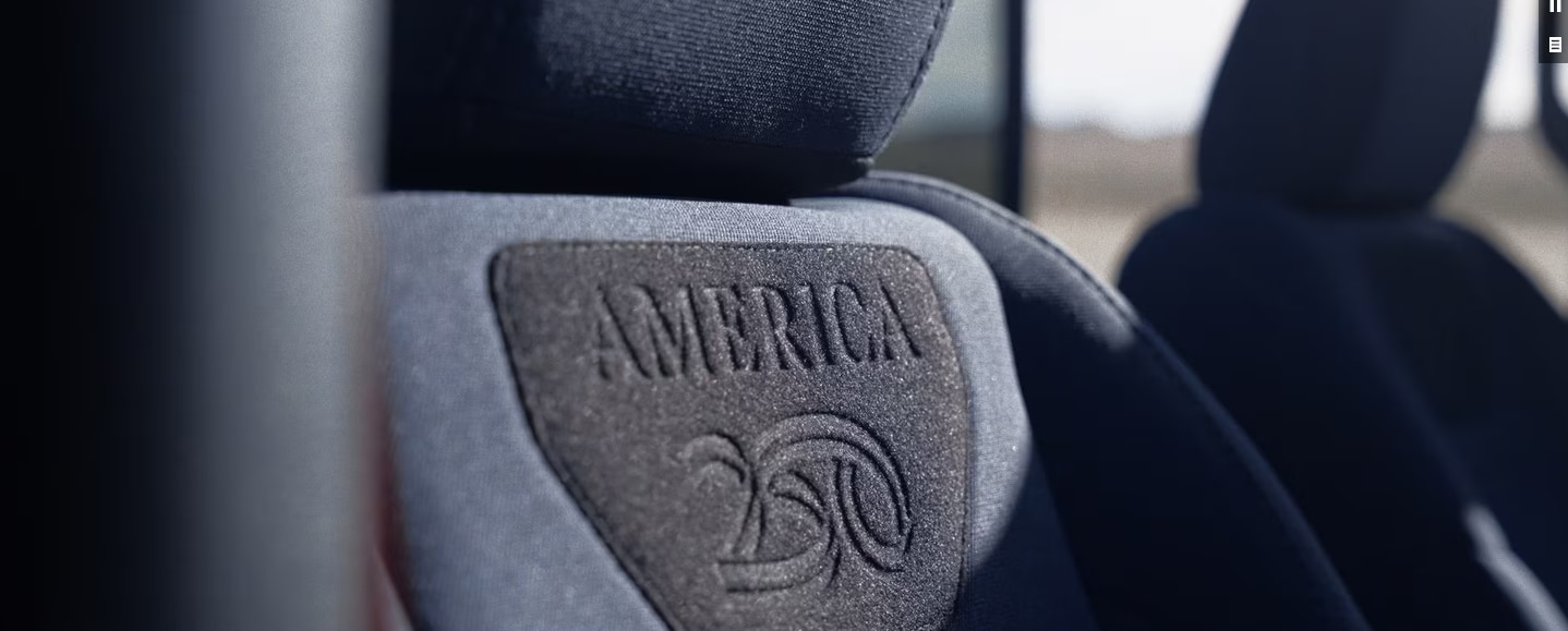 2026 Jeep Wrangler America250 Edition interior with Jean Blue seats and red seat belts