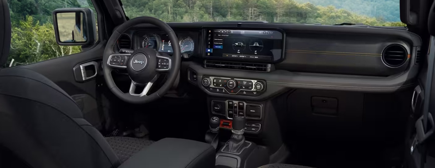 2027 Jeep Wrangler Smoky Mountain dark interior with Terracotta stitching and Willys parachute graphic seats