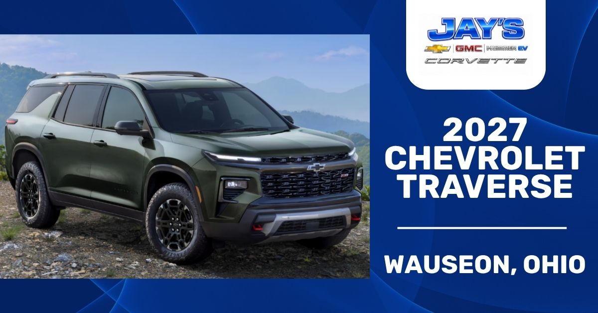 Promotional graphic for Jay’s Chevrolet in Wauseon, Ohio featuring a green 2027 Chevrolet Traverse SUV on a mountain trail beside bold dealership branding on a blue background.
