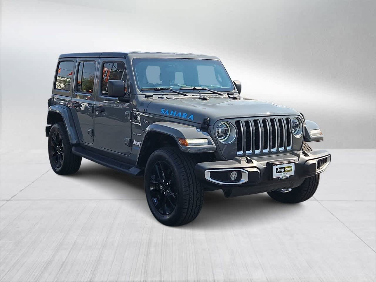 Used 2021 Jeep Wrangler Unlimited Sahara 4XE with VIN 1C4JJXP67MW766153 for sale in Las Vegas, NV
