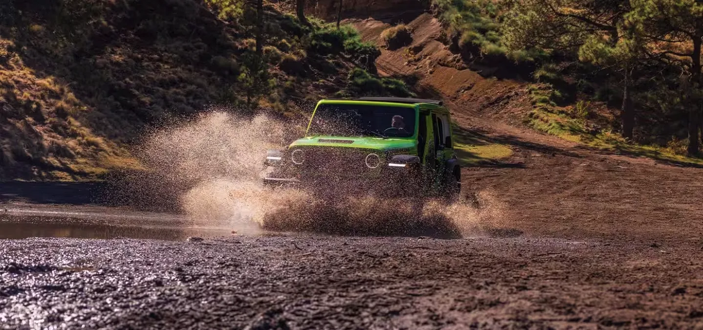 Jeep Wrangler splashing through a desert water crossing outside Las Vegas, Nevada