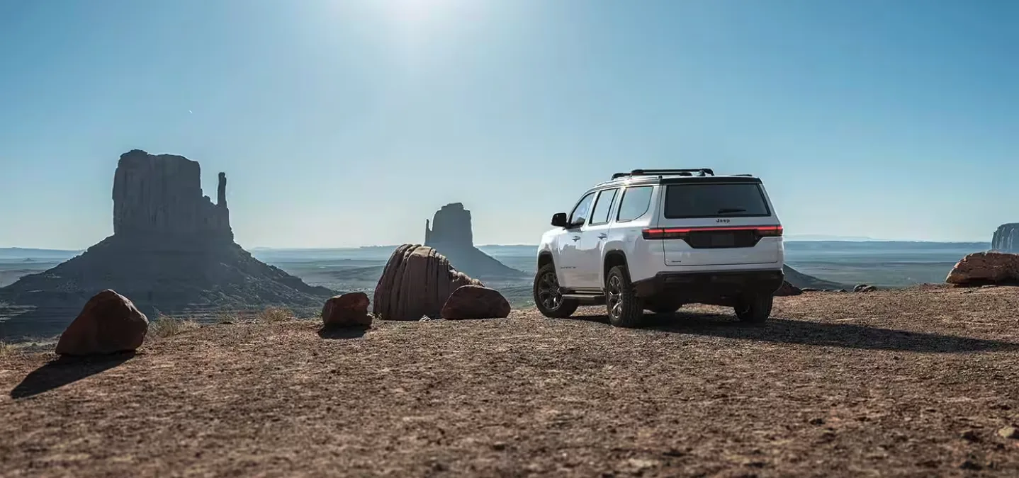 White Jeep Wagoneer parked in the desert Southwest, representing trade-ins appraised on site in Las Vegas