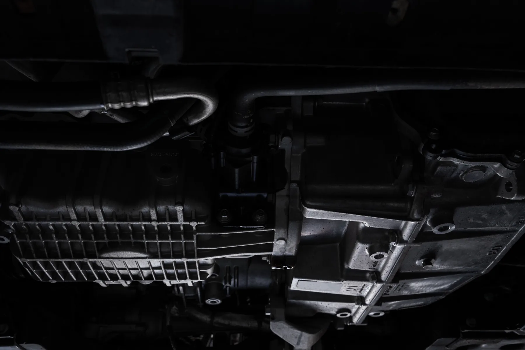 Underside inspection of a Jeep transmission housing