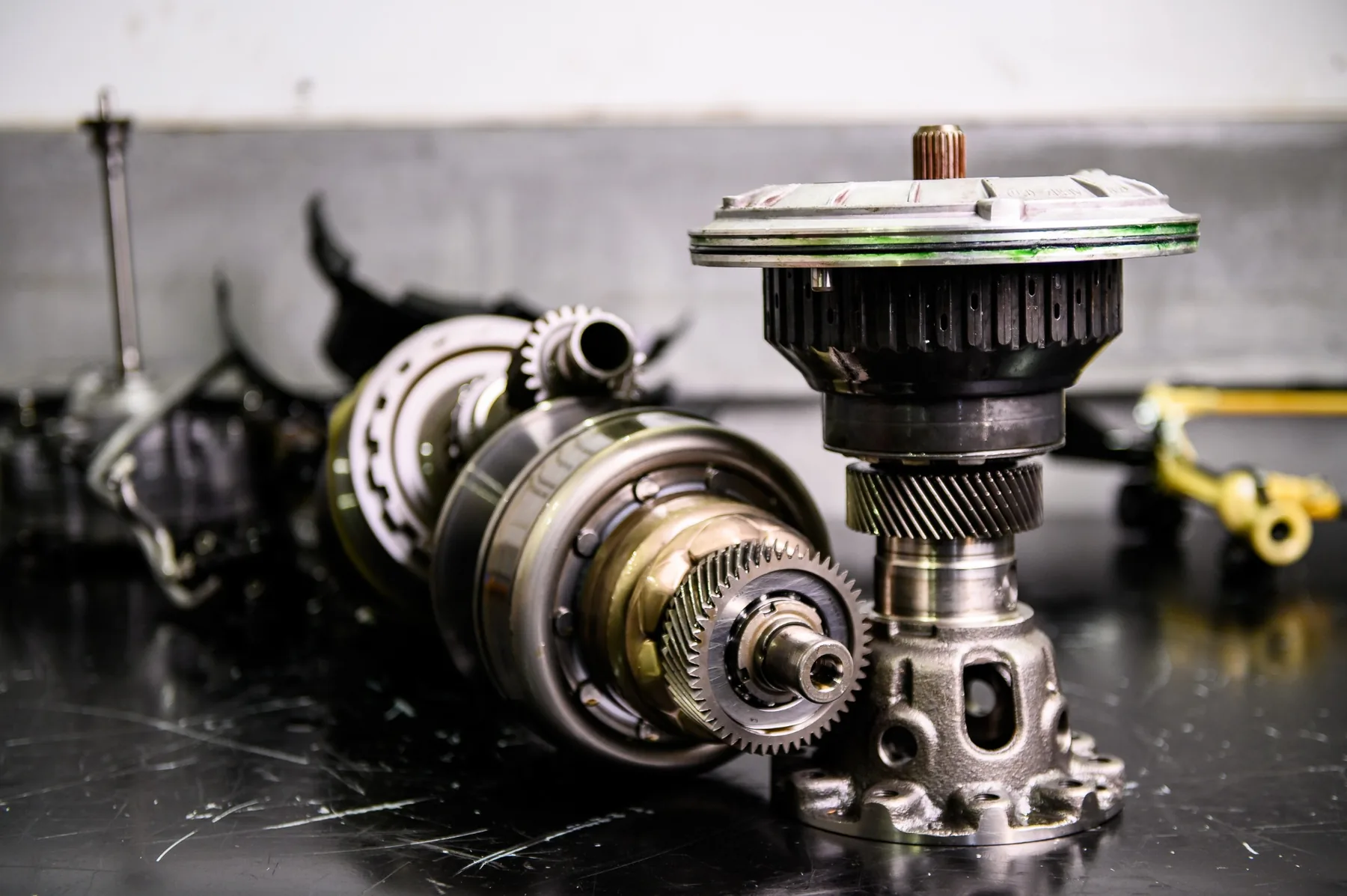 Disassembled Jeep transmission internals on a workbench
