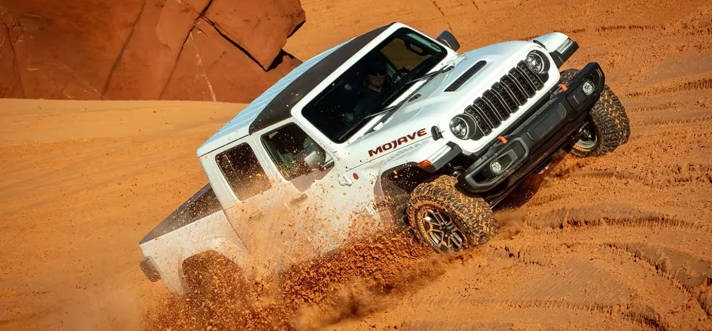Used Jeep Gladiator Mojave Las Vegas Sand Dunes Jeep Gladiator Mojave parked on sand dunes outside Las Vegas