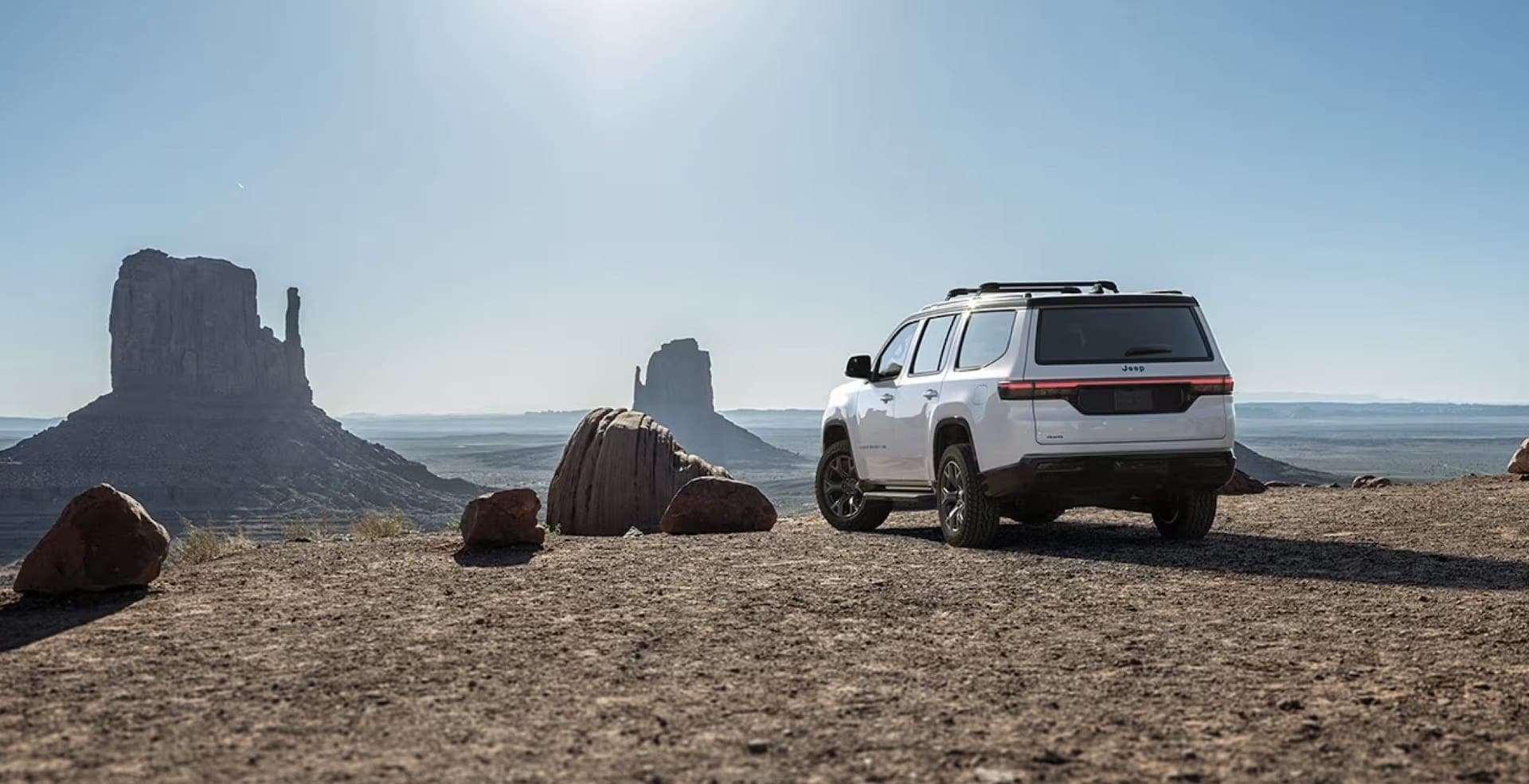 2026 Jeep Grand Wagoneer exterior, three-quarter rear view with alloy wheels