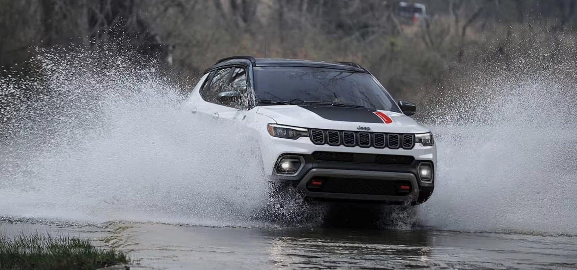 2026 Jeep Compass compact SUV, rear three-quarter view showing the liftgate