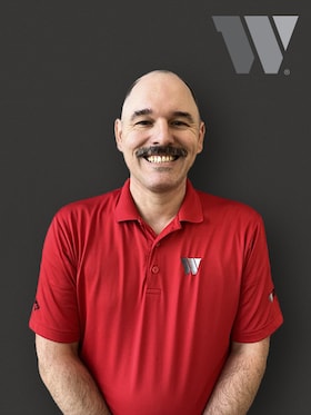 Staff member John Raster from ID_99e9c43ce175