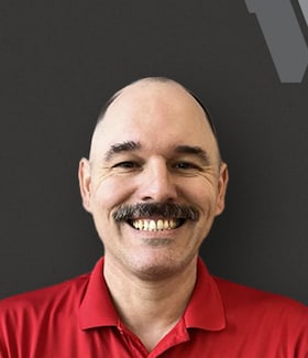 Staff member John Raster from ID_99e9c43ce175