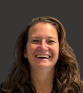 Staff member Gina McDougal from ID_3ff962216361