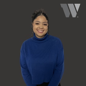 Staff member Hannah Acton from ID_6b77a1357f41