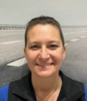 Staff member Gina McDougal from ID_1ae7fa0216a7